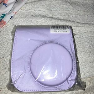 This is a really cute polaroid camera case and it comes with the string